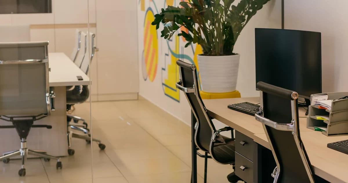 Ruang kantor modern dengan meja dan kursi kerja - PT. Berkah Karunia Fajar